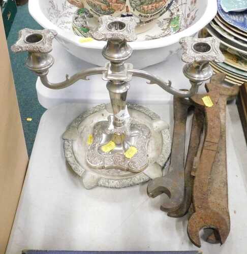 Various iron hand spanners, large ashtray, silver plated candelabra.