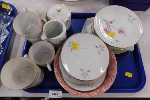 A Leftman Vider part service, decorated with flowers and a red transfer printed bowl.