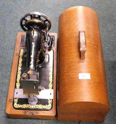 A Singer cased sewing machine.