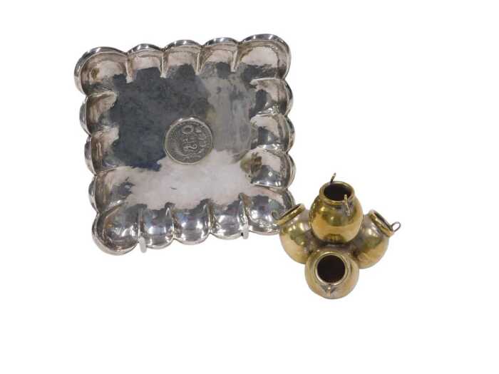 A 20thC Peruvian dish, of shaped square form, centred by a 1/2 Sol coin, dated 1916, marked Peru...