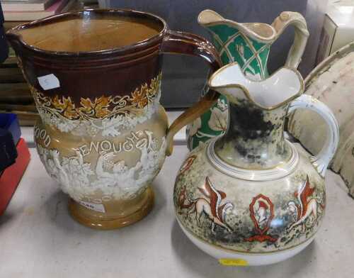 A 19thC stoneware jug, raised with satyr, two further 19thC jugs. (1 box)