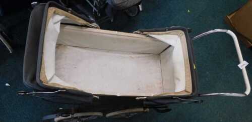A vintage four wheel pram.