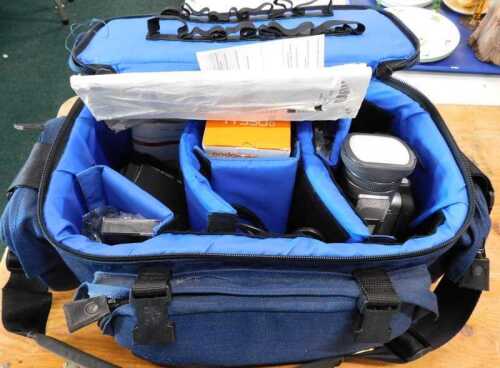 A Panasonic digital NX-DX110 camcorder, with various accessories, partially cased.