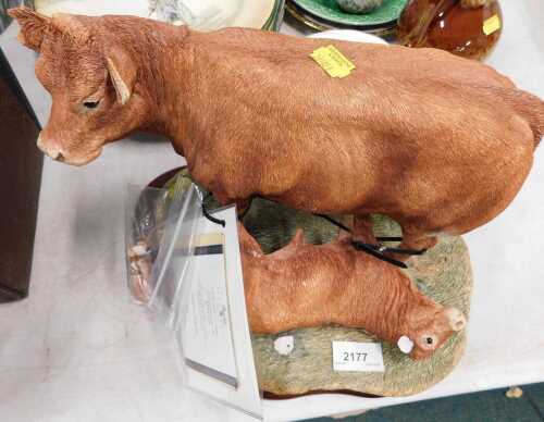 A Border Fine Arts figure group, D'Aquitaine cow and calf, limited edition number 791/1250....