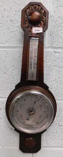 An oak cased hanging barometer.