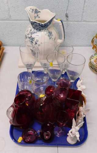A pottery jug, various ruby, cranberry style and other glassware, set of three angel figures,...