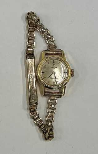 Omega, Ladymatic watch, with a rolled gold strap.