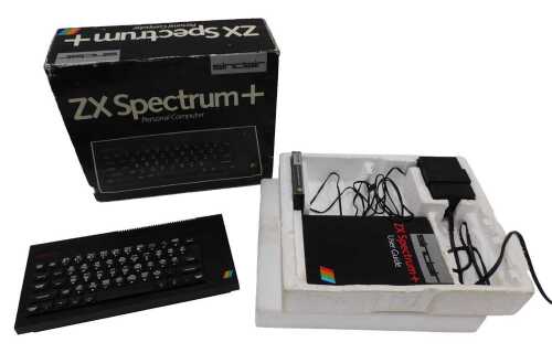 A Sinclair ZX Spectrum Plus personal computer, with keyboard, 32cm wide, user guide cassette,...