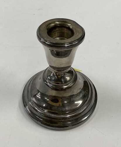 A silver dwarf candlestick (weighted)