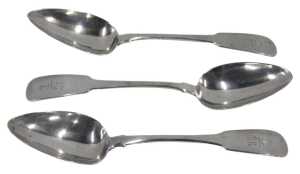 A set of three George III Irish silver tablespoons, Fiddle pattern with anchor crests, by...
