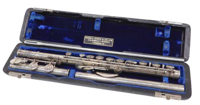 An Elizabeth II three piece silver flute, with articulated stops, numbered 8921 and marked...