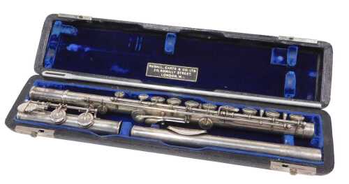An Elizabeth II three piece silver flute, with articulated stops, numbered 8921 and marked...