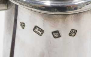A pair of Elizabeth II silver water jugs, each with domed lids, shaped ear handles and plain... - 2