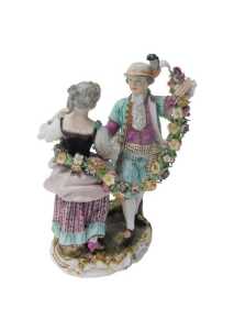 A late 19th/early 20thC Meissen porcelain figure group, of a male and female dancing, holding a...