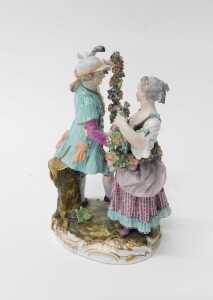 A late 19th/early 20thC Meissen porcelain figure group, of a male and female dancing, holding a... - 2