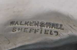 A George V silver three handled bowl, of shaped circular form, on hoof feet, marked Bingham Golf... - 2
