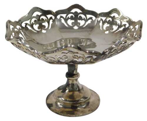 A George VI silver footed bonbon dish, with flared floral rim, on inverted stem and circular...