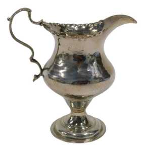 A George III silver cream jug, with plain spout, flared rim, acanthus leaf ear shaped handle,...