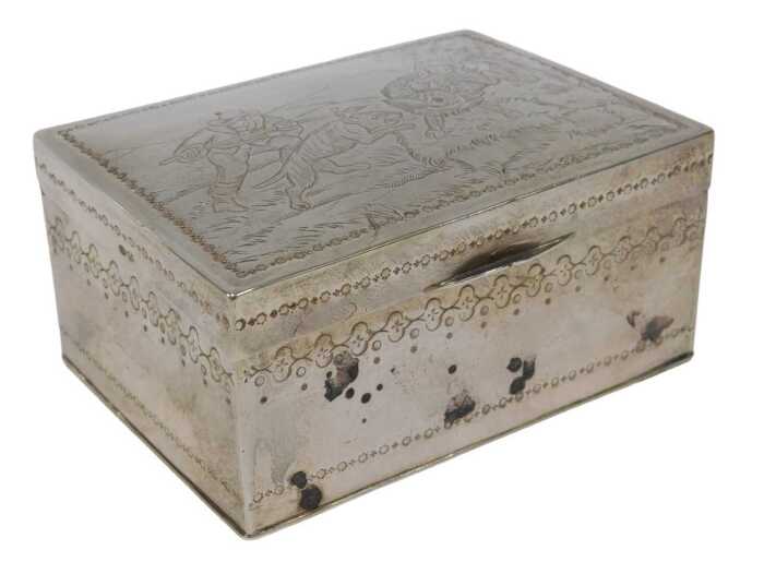 A George V silver and silver gilt box, of rectangular form, embossed with figure hunting, with a...