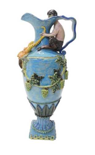 A late 19thC Castle Hedingham style Majolica ewer, with shaped spout and ribbon handle, set with...
