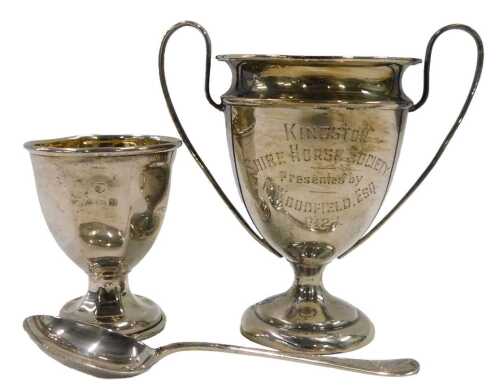 A George V silver miniature trophy, with plain shaped handles, inverted egg shaped body, and...