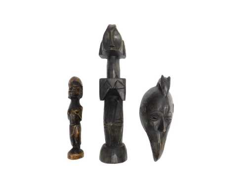 Various African tribal figures, a wall mask, 36cm high, and two totem style figures. (3)