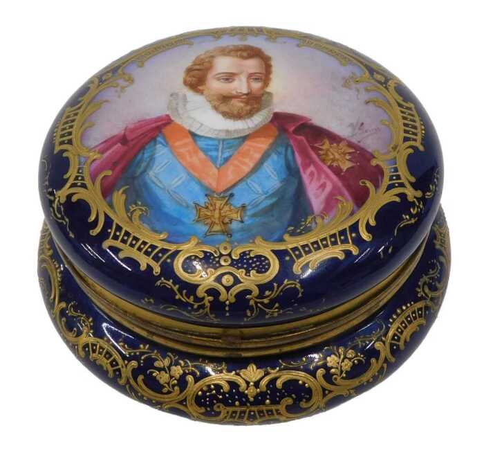 An early 19thC Sevres porcelain box, of circular form, the hinged lid expertly decorated with a...