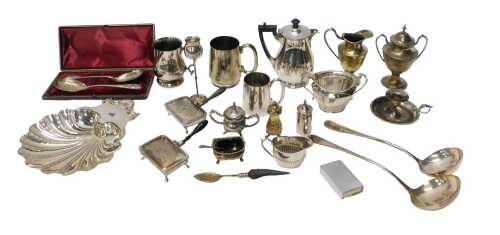 An early 20thC silver plated shell shaped serving dish, with shell and scroll handle, and crest,...