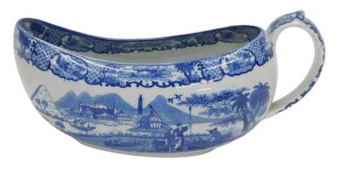 An early 19thC blue and white pottery bourdaloue, with thumb mould handle and slipper shaped...