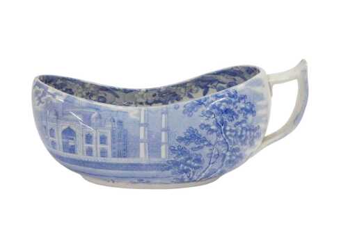 A 19thC English blue and white transfer printed pottery bourdaloue, with shaped handle, slipper...