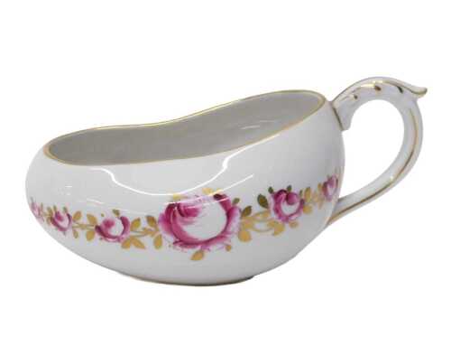 A Limoges France porcelain bourdaloue, with acanthus leaf handle and slipper shaped body, each...