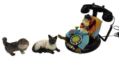 A Goofy articulated telephone, with front dial, Beswick cat 1559, and another. (3)