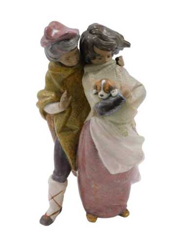 A Lladro figure group Facing the Wind, matte finish, 38cm high.