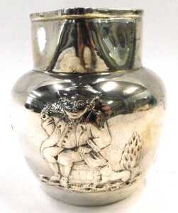A Victorian silver jug, with beak spout and strap handle, the main body showing tavern scenes,... - 2
