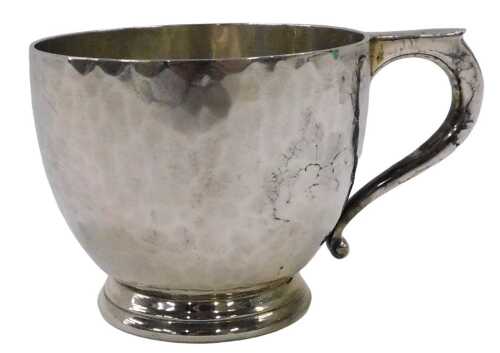 A George V silver overlaid cup, of circular form, with shaped handle, on circular foot, by...