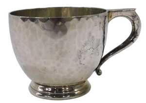 A George V silver overlaid cup, of circular form, with shaped handle, on circular foot, by...