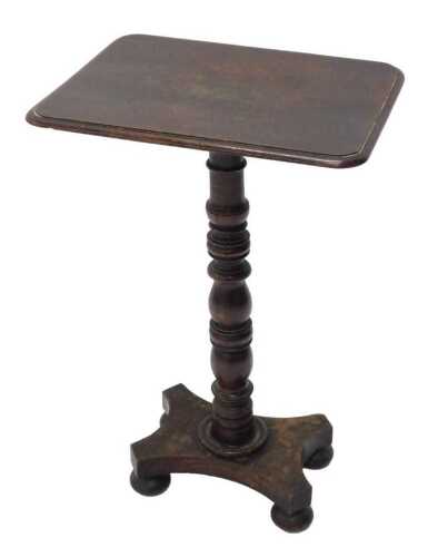 A 19thC mahogany tilt top occasional table, the oblong top on a turned stem terminating in an...