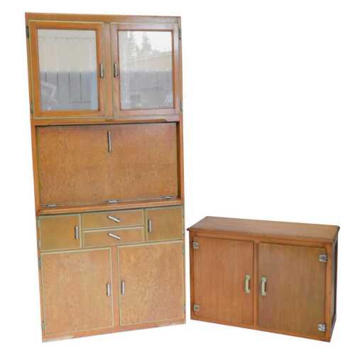 A mid 20thC oak The Dorchester kitchen larder cabinet, the upper section with a double cupboard...