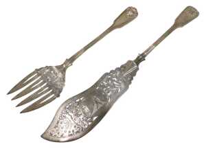 A pair of Victorian silver fish servers, shell capped Old English pattern, by Thomas Wallis II,...