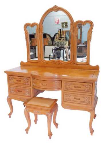 A 20thC Oriental design hardwood dressing table, the three part mirrored back raised above a...