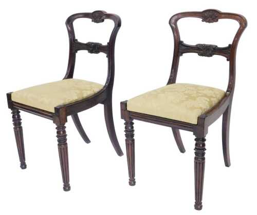 A pair of mid 19thC rosewood dining chairs, with arched cresting rail centred by carved floral...