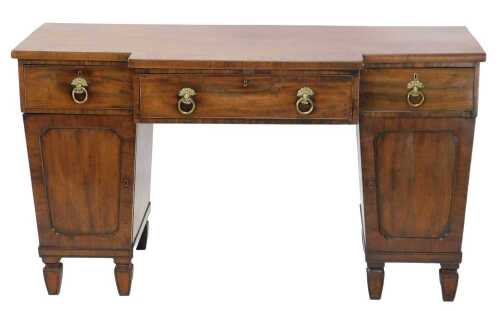 A Victorian mahogany twin pedestal breakfront sideboard, with a wide crossbanding raised above...