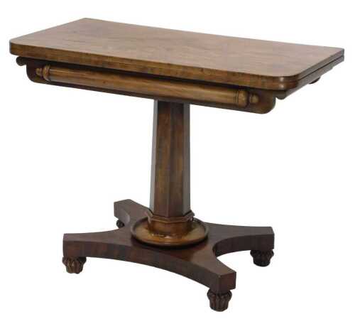 An early Victorian mahogany D end fold over games table, the oblong top raised on an octagonal...
