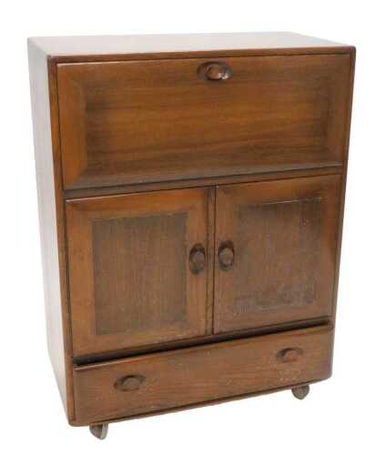 A 20thC Ercol Windsor model 469 cocktail cabinet, of rectangular form with visible dovetails and...