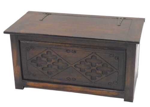 A 20thC oak blanket box, the plain rectangular lid with heavy hammered iron hinges, revealing a...