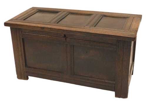An 18thC oak two panelled coffer, the plain lid revealing a plain interior with candle box...