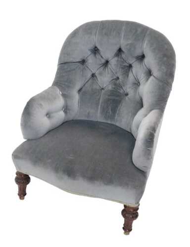 A Victorian walnut framed button back nursing armchair, with studded back and arms, and...