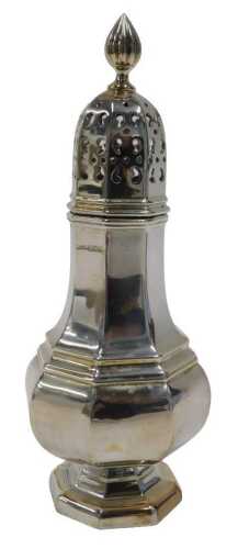 A George V silver sifter, of octagonal form, with flame finial, pierced domed lid, shaped...