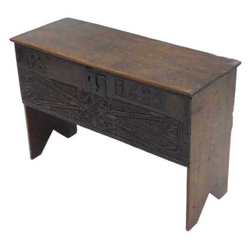 A 17thC oak coffer of small proportion, the plain rectangular top revealing a plain interior...
