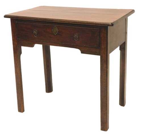 An Edwardian mahogany lowboy or side table, the oblong top raised above a frieze drawer, on...
